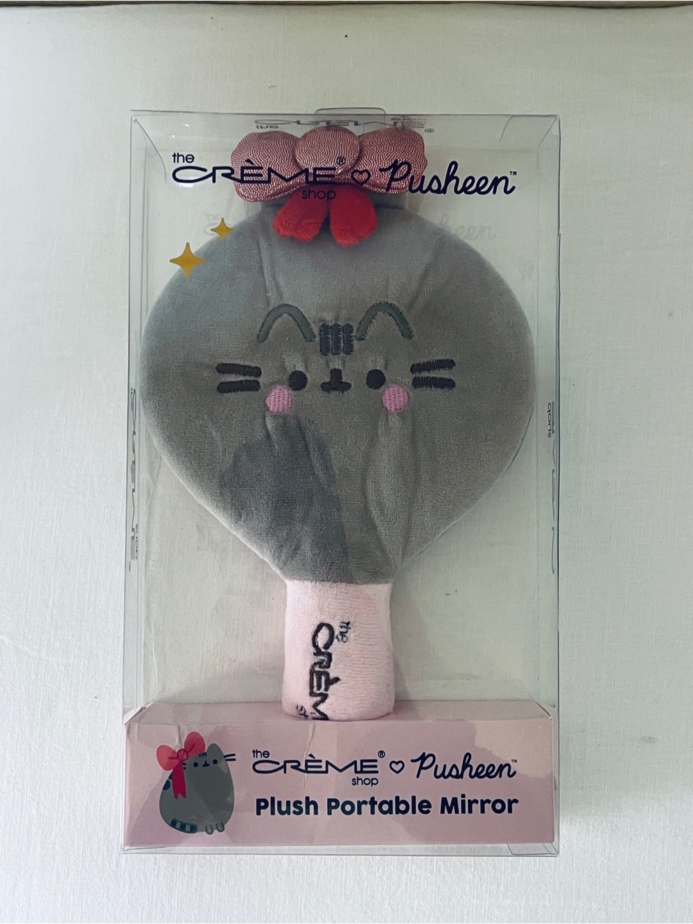 The Crème Shop x Pusheen Plush Portable Mirror in Gray with Pink Accents